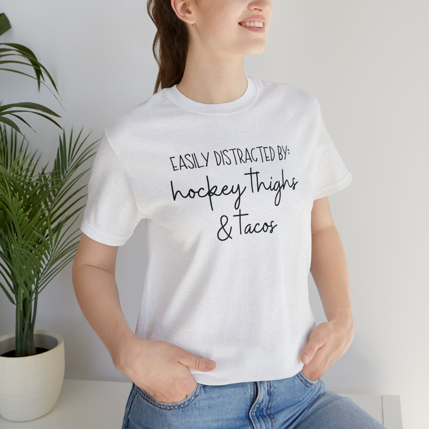 Easily Distracted by: Hockey Thighs and Tacos Unisex Bella + Canvas Tee