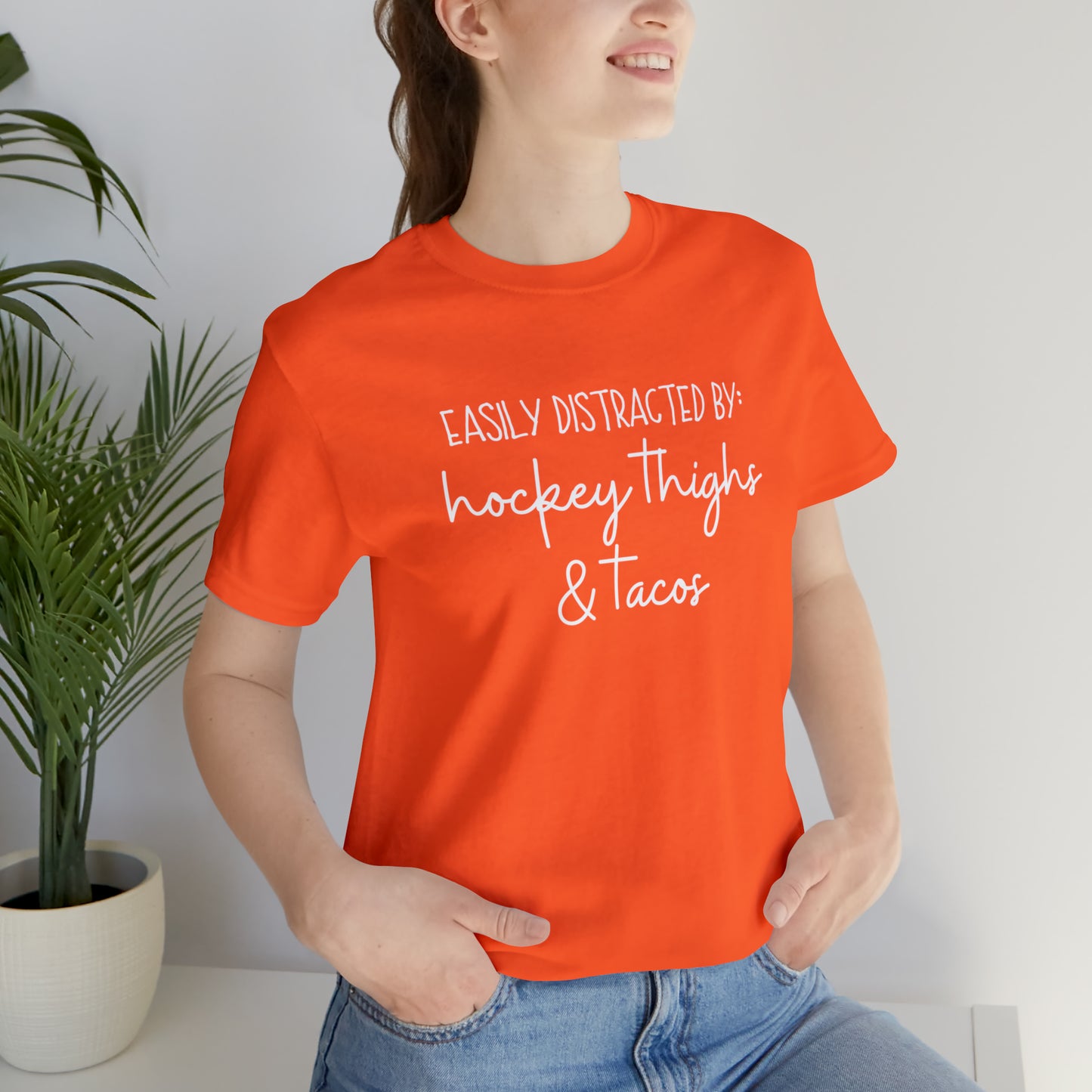 Easily Distracted by: Hockey Thighs and Tacos Unisex Bella + Canvas Tee