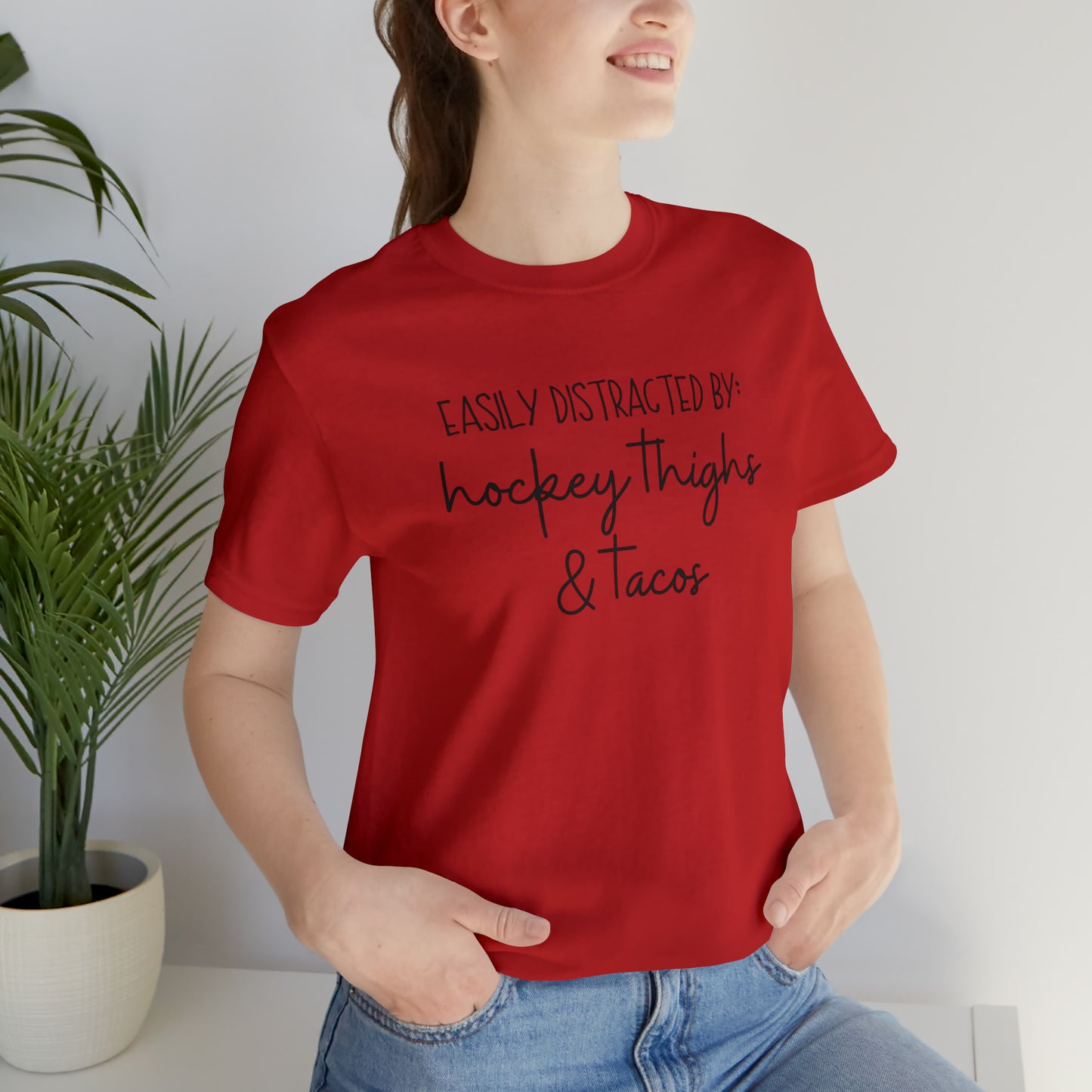 Easily Distracted by: Hockey Thighs and Tacos Unisex Bella + Canvas Tee